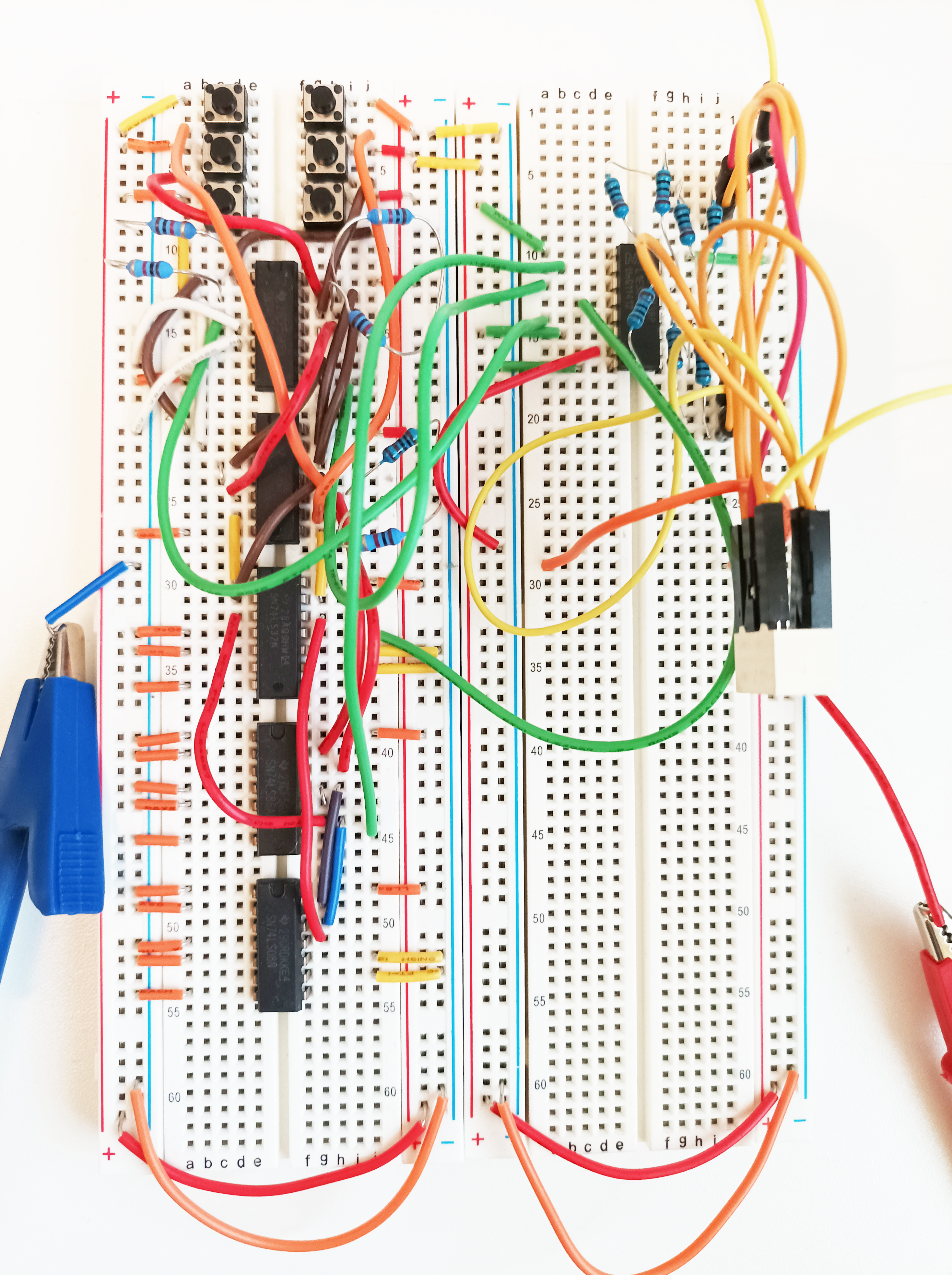 Two breadboards side by side. The left hand board has the 3-bit adder circuit. The right hand board has the 7 segment display decoder.