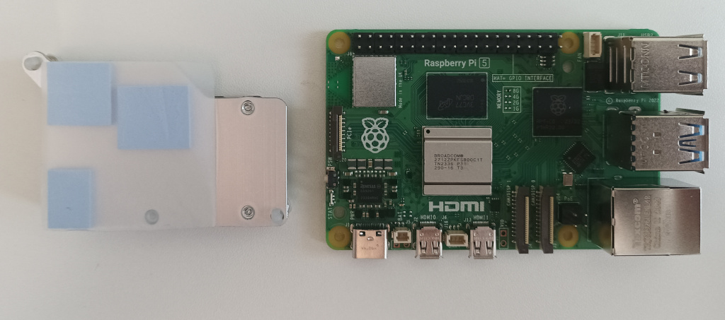 The underside of the Raspberry Pi active cooler showing the thermal pads.