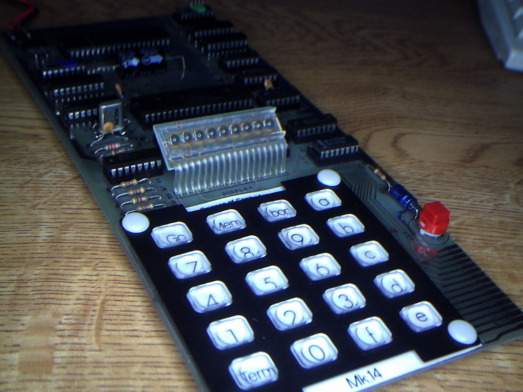 Science of Cambridge (Sinclair) MK14 computer. Image shows a single circuit board with a calculator style keypad and an LED display.